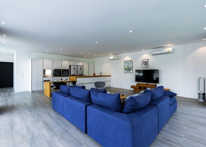 Open-plan living room and kitchen after renovation