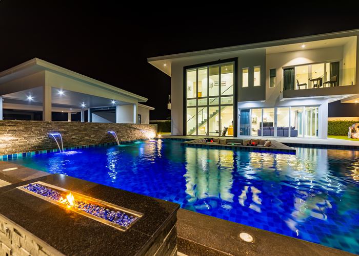 Palm Garden villa pool with fire feature at night