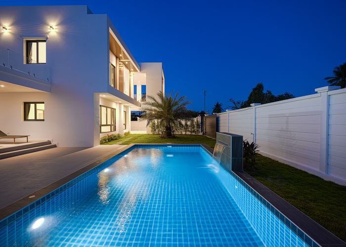 Private pool and villa at dusk, Soi 102 project